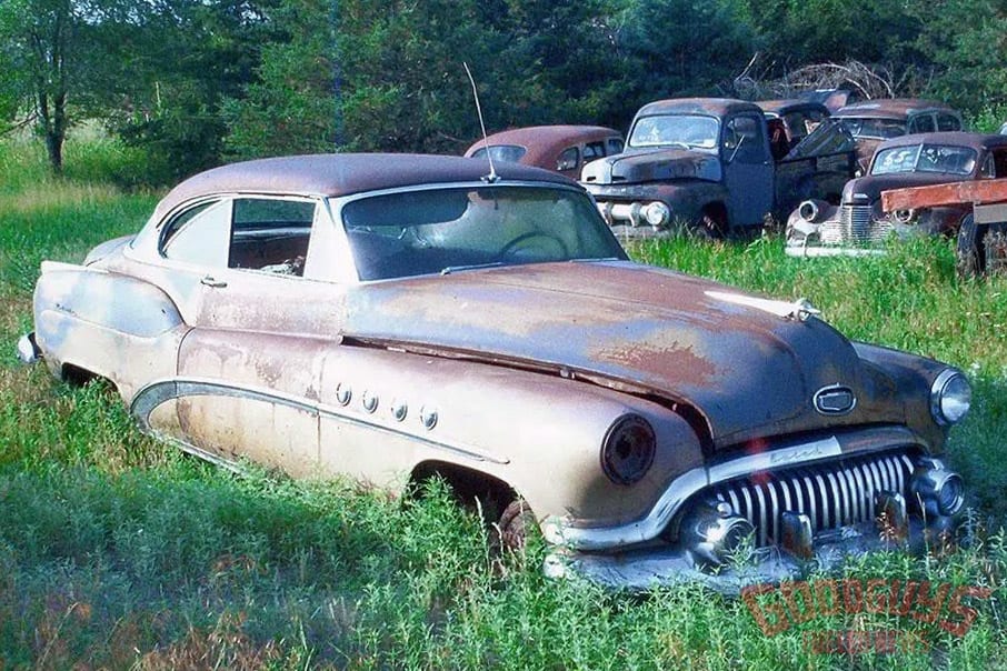 1952 Buick Riviera rusted in a field