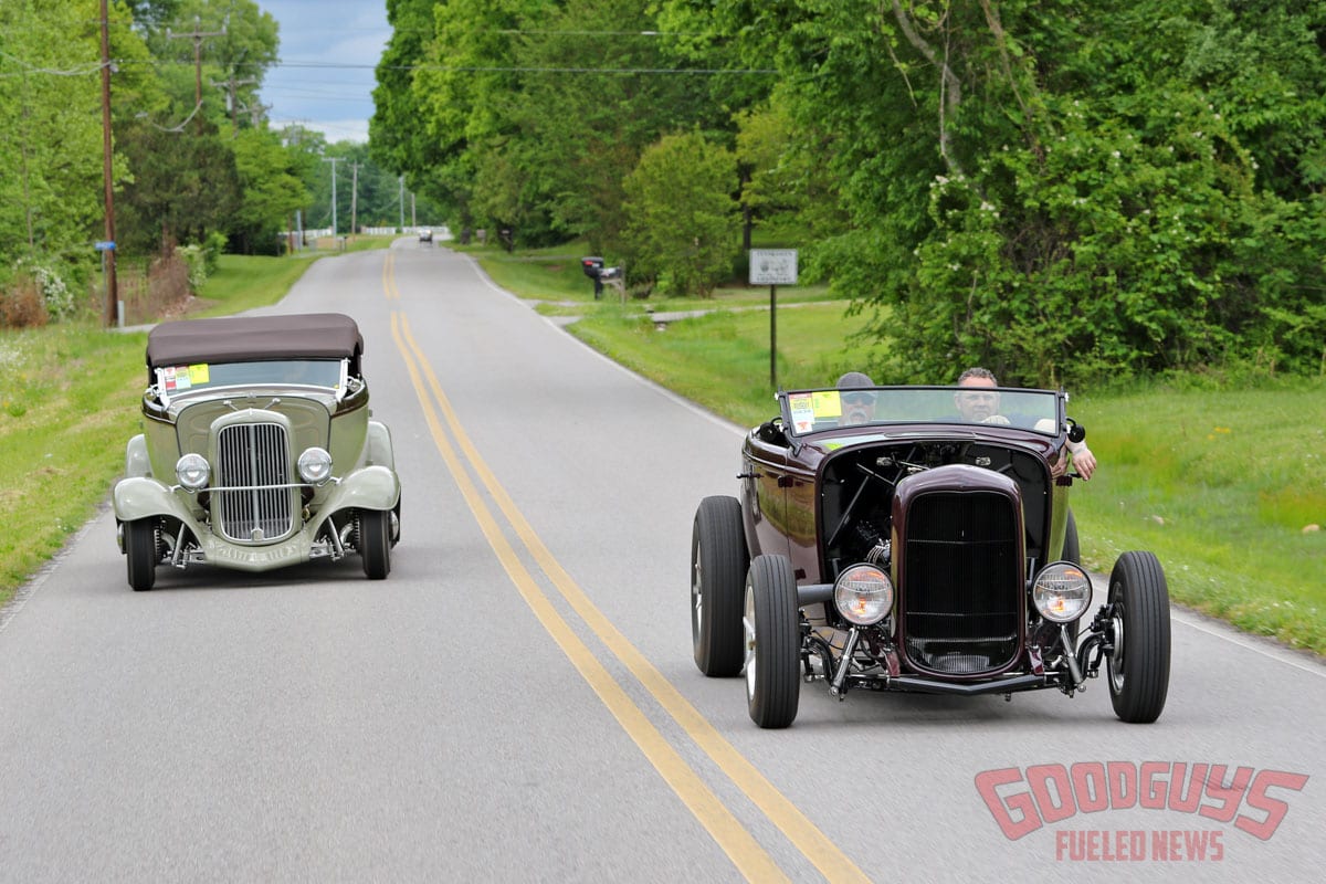 1932 ford phaeton street rod and 1932 ford hiboy hot rod cruising down the road